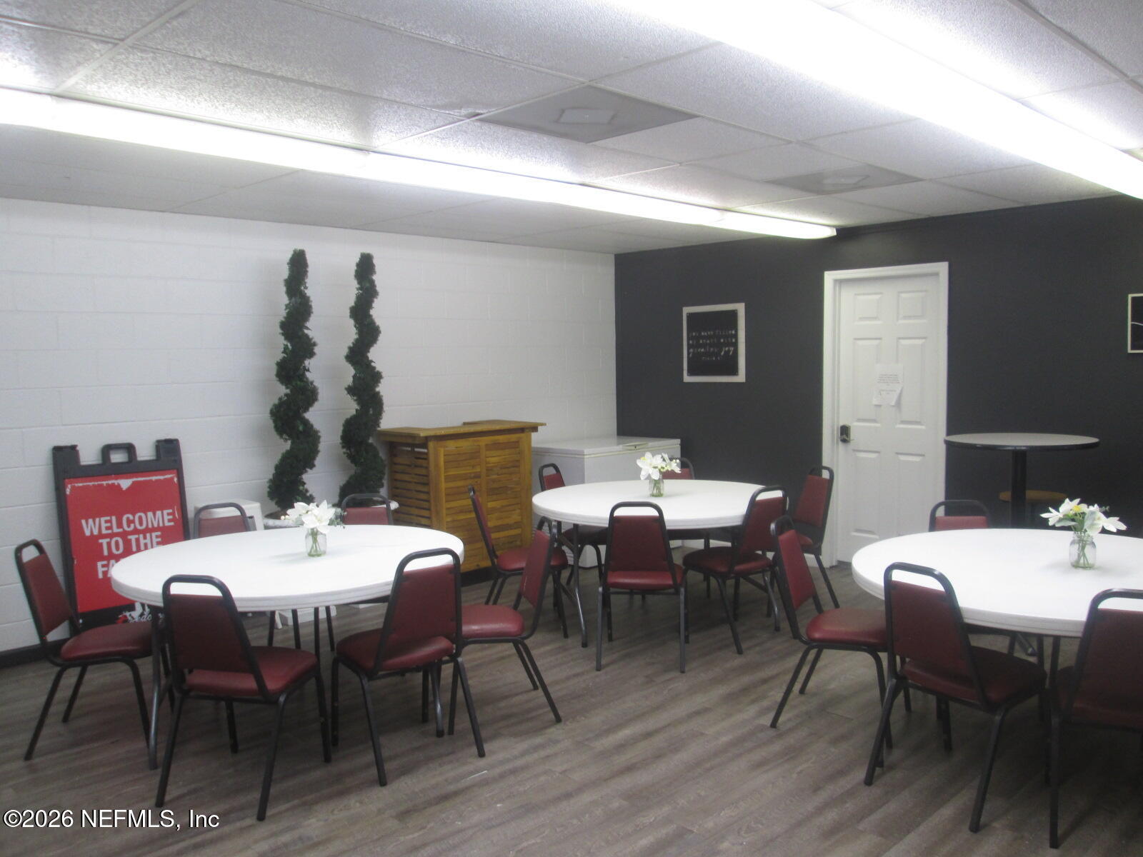 555 Highway 16 St. Augustine, FL 32084 - Photo 24 of 60 a view of a dining room with furniture and wooden floor