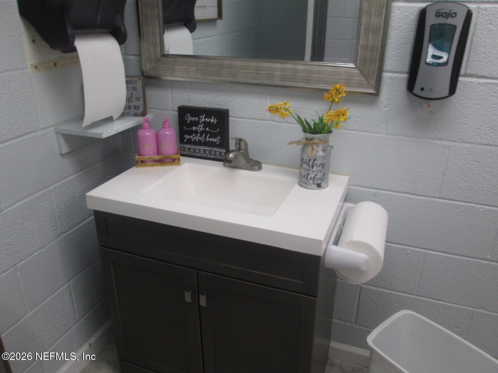 555 Highway 16 St. Augustine, FL 32084 - Photo 38 of 60 a bathroom with a sink and a mirror