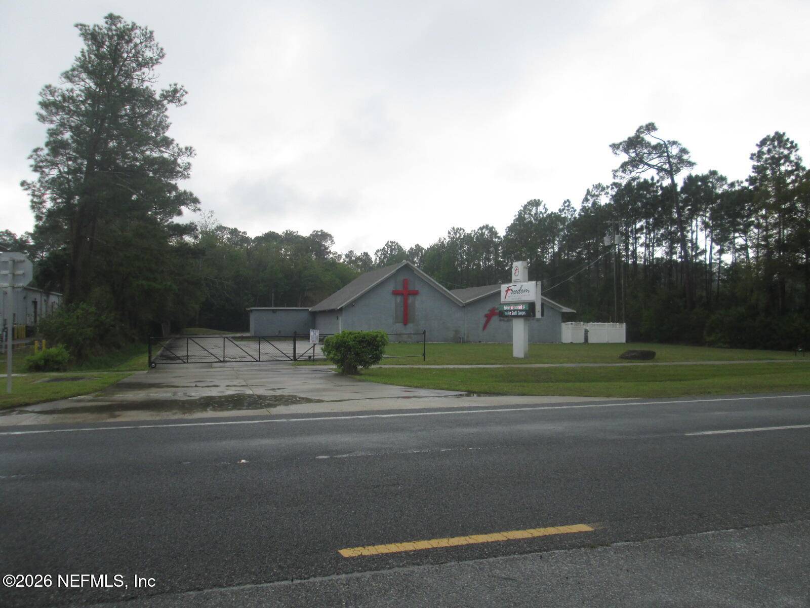 555 Highway 16 St. Augustine, FL 32084 - Photo 45 of 60 a front view of a house with a yard and garage