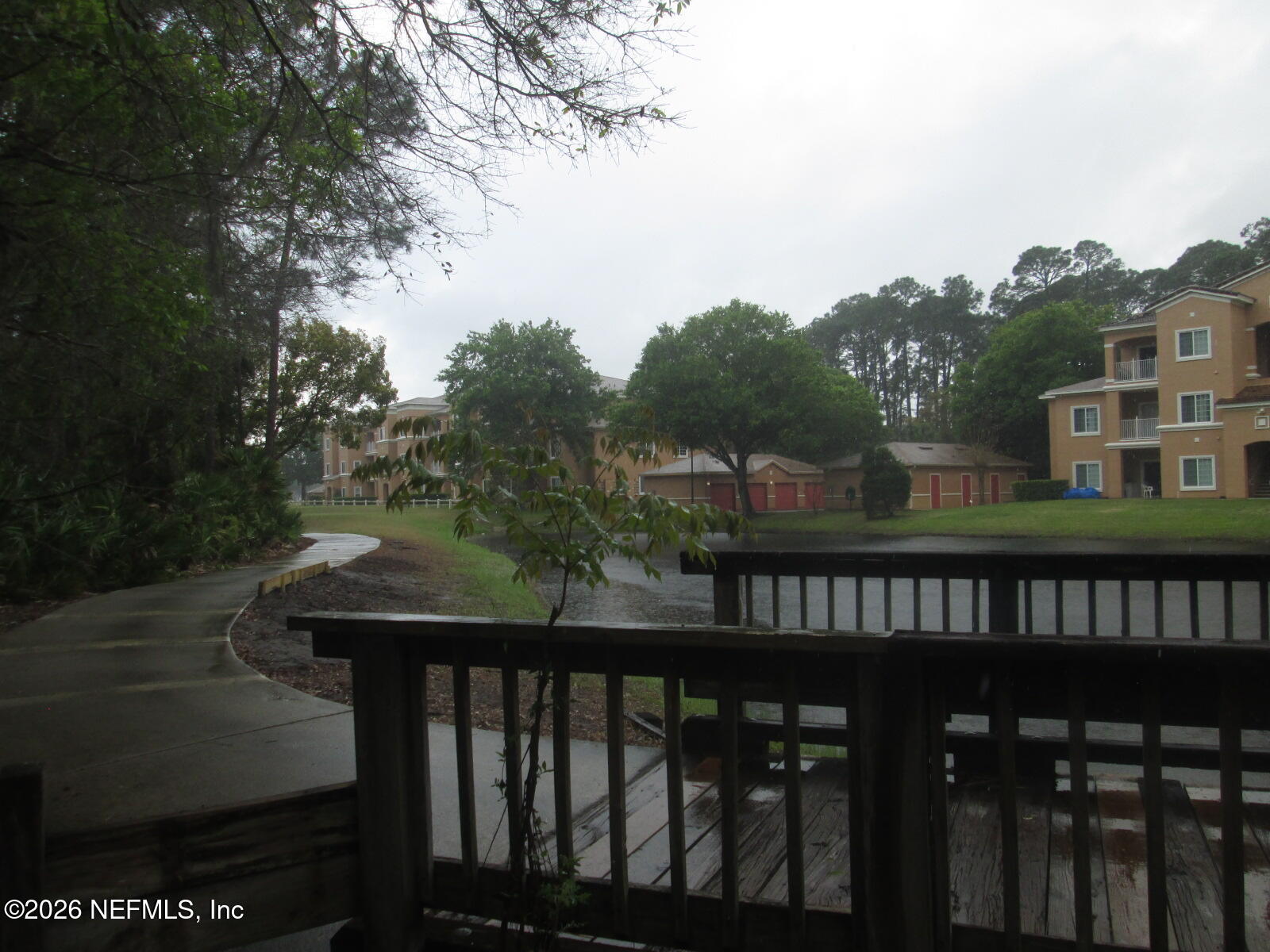 555 Highway 16 St. Augustine, FL 32084 - Photo 55 of 60 a view of a balcony with wooden fence and floor