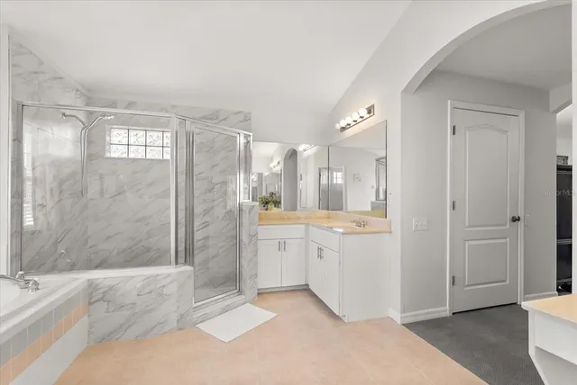 a view of a bedroom with cabinet and a window