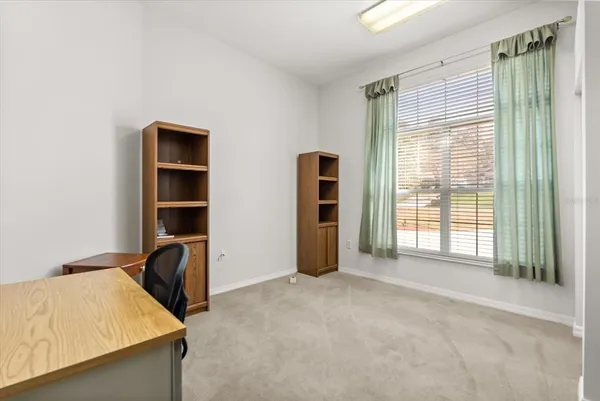 a view of a workspace with furniture