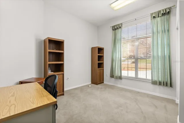 a view of a workspace with furniture