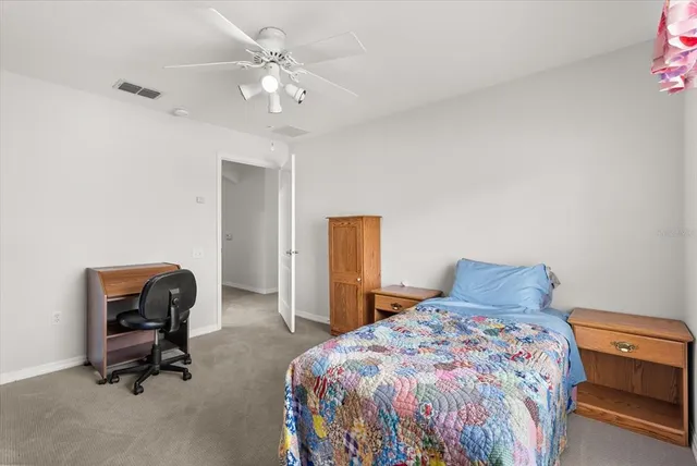 a bedroom with furniture and a window