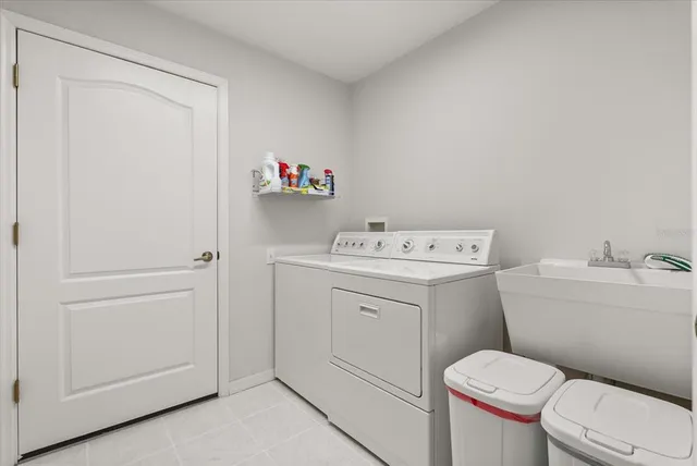 a view of a chairs and table in patio