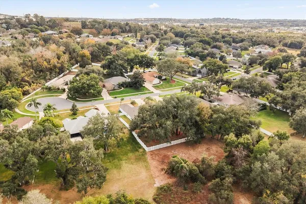 a aerial view of a residential apartment building with a yard