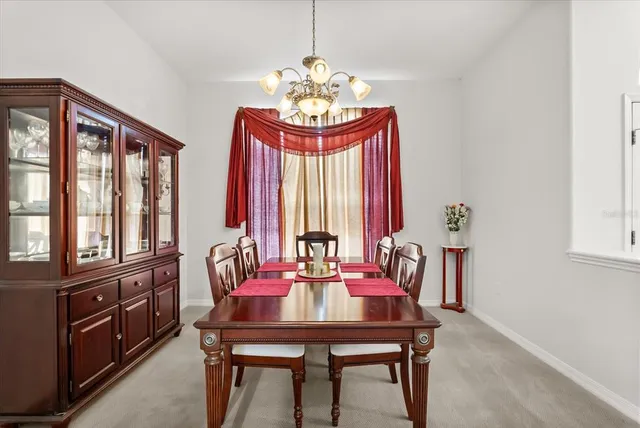 a dining room with furniture and window