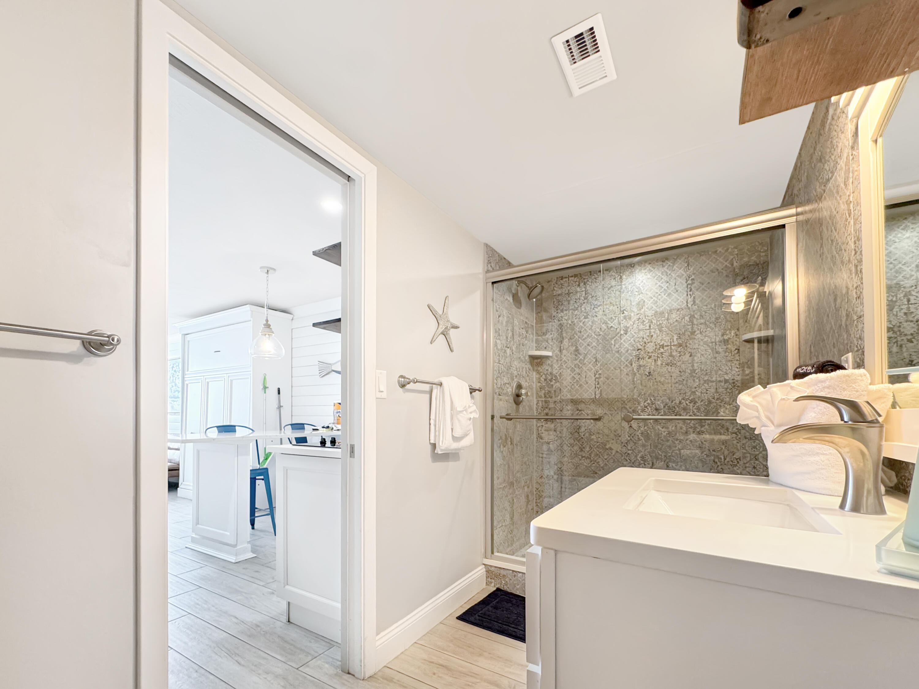 14401 Front Beach Road, Unit 221 Panama City Beach, FL 32413 - Photo 12 of 20 a bathroom with a sink toilet and shower