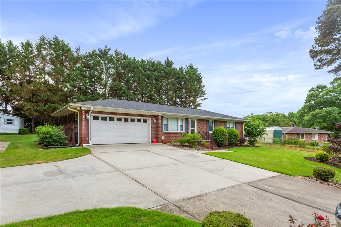 202 Keowee Trail Seneca, SC 29672 - Photo 22 of 35 This classic brick residence features a spacious driveway and attached garage.
