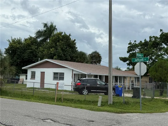 a view of house with outdoor space and garden
