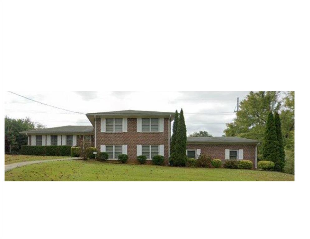 2379 Manassas Lane Decatur, GA 30034 - Photo 1 of 1 a view of house in front of a big yard with plants and large trees