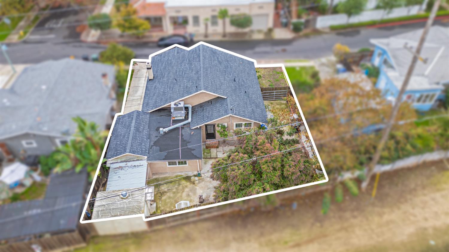 223 Achor Court Modesto, CA 95354 - Photo 24 of 26 a view of a large building with a small yard