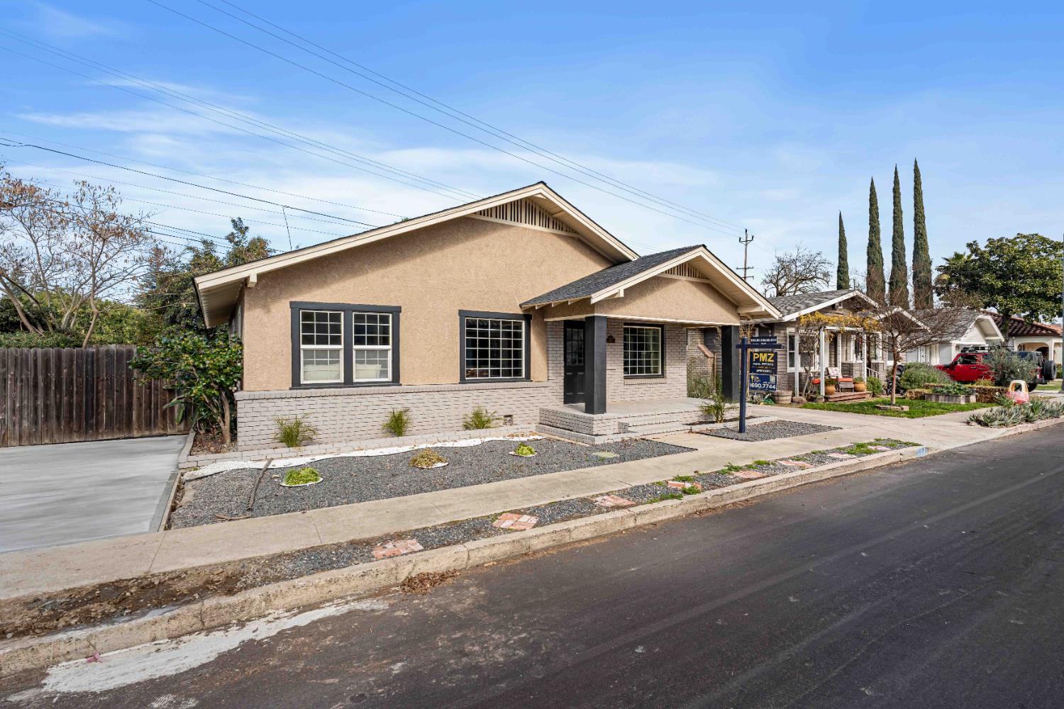 223 Achor Court Modesto, CA 95354 - Photo 4 of 26 a front view of a house with a garden and plants
