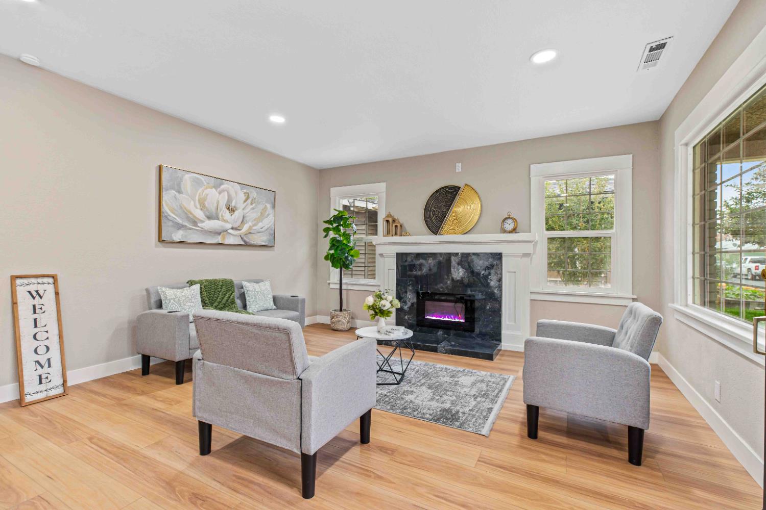 223 Achor Court Modesto, CA 95354 - Photo 7 of 26 a living room with furniture and a fireplace