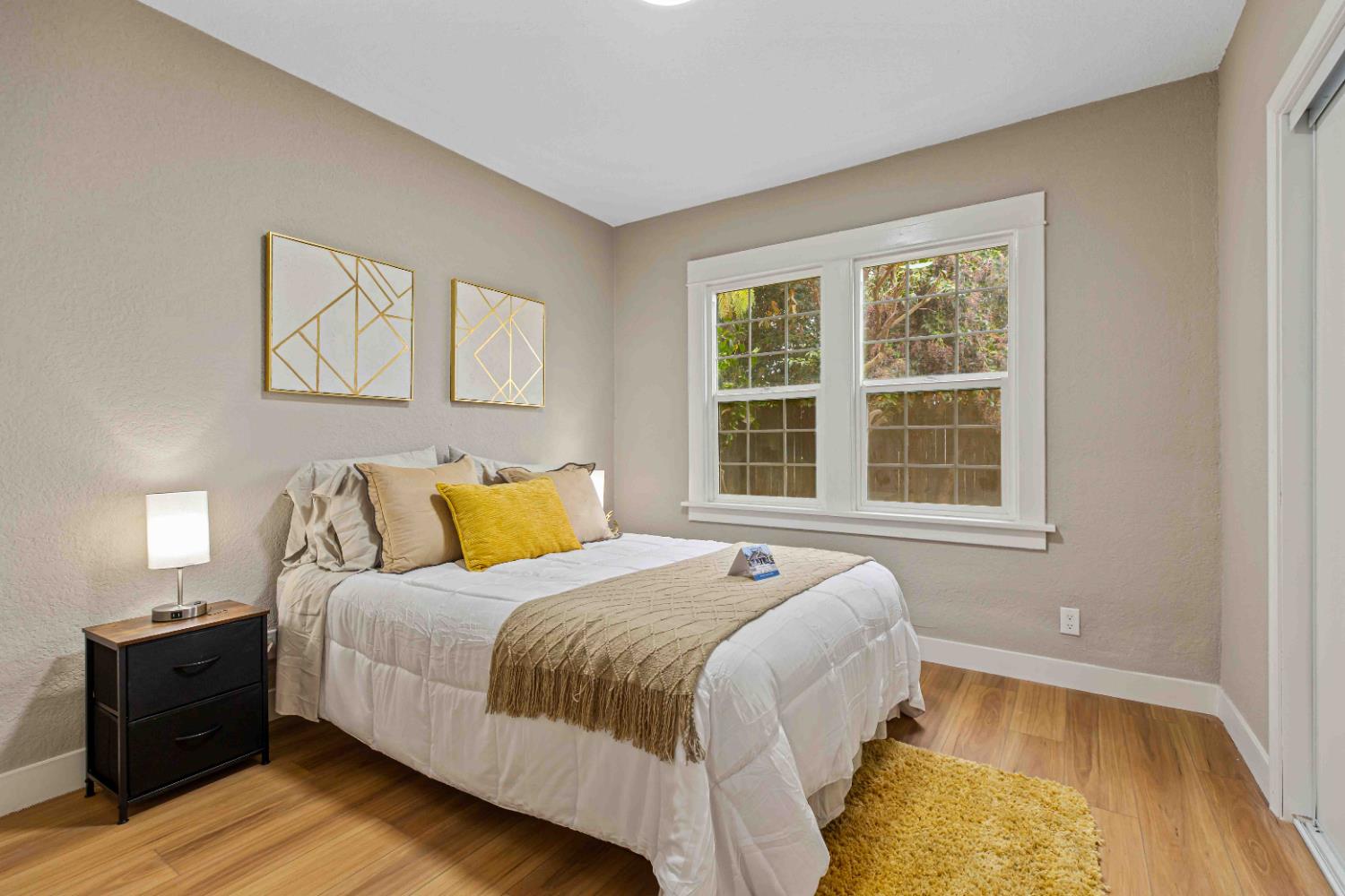 223 Achor Court Modesto, CA 95354 - Photo 10 of 26 a bedroom with a bed and wooden floor