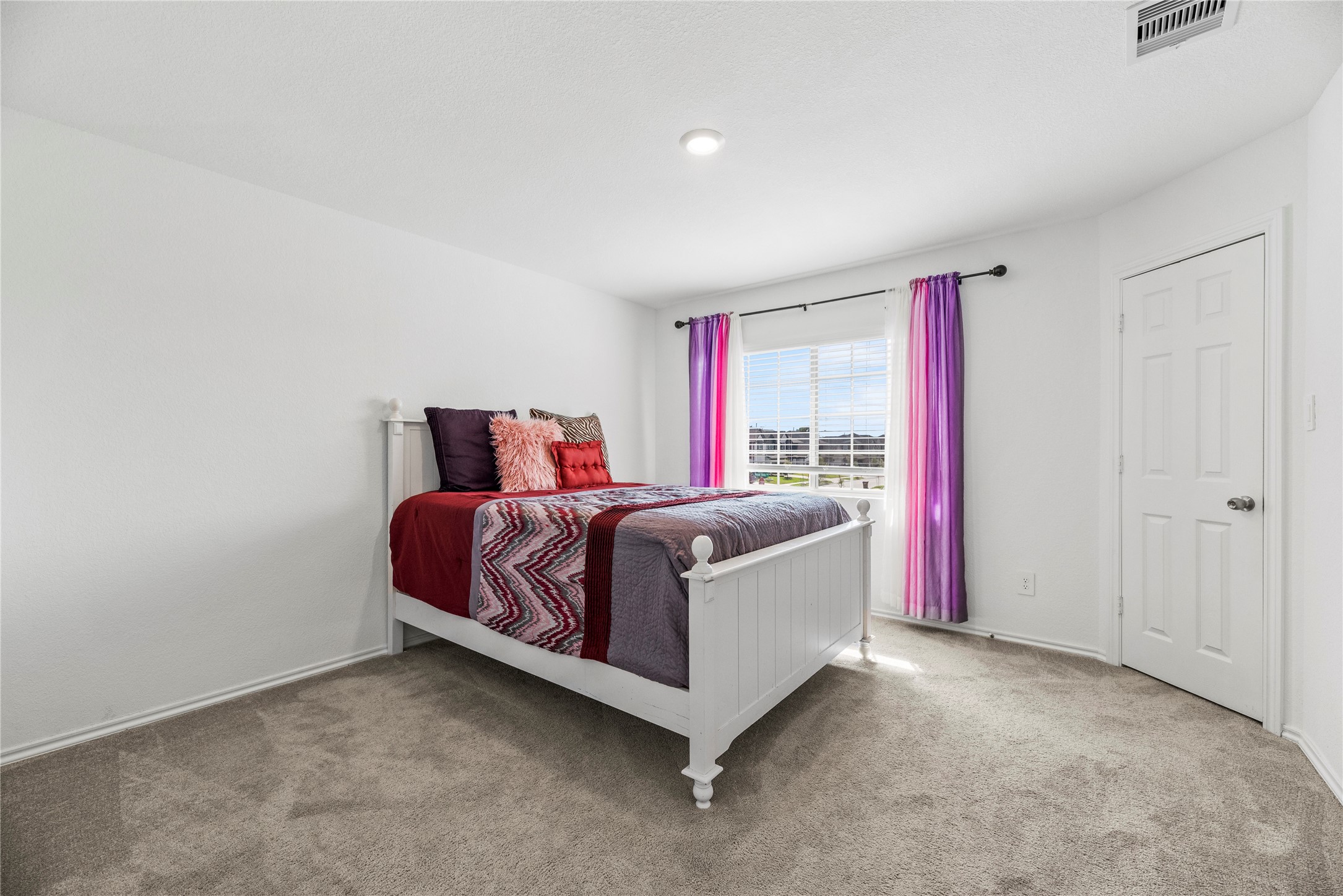 5423 Rosser Ruby Way Brookshire, TX 77423 - Photo 12 of 20 a spacious bedroom with a bed and a window