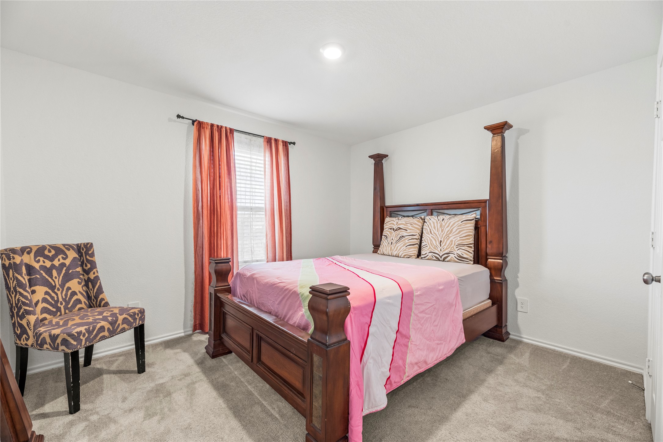 5423 Rosser Ruby Way Brookshire, TX 77423 - Photo 15 of 20 a bedroom with a bed and chair