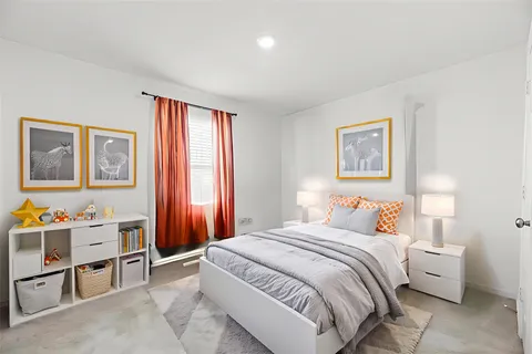 a bedroom with a bed and a closet