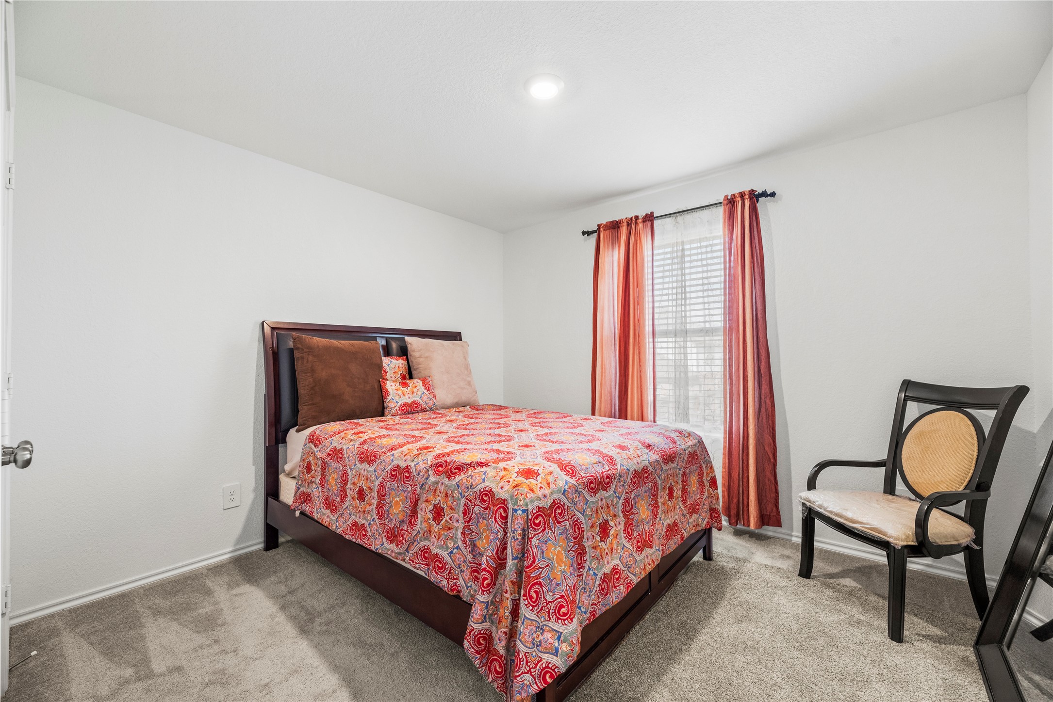 5423 Rosser Ruby Way Brookshire, TX 77423 - Photo 10 of 20 a bedroom with a bed chair and window