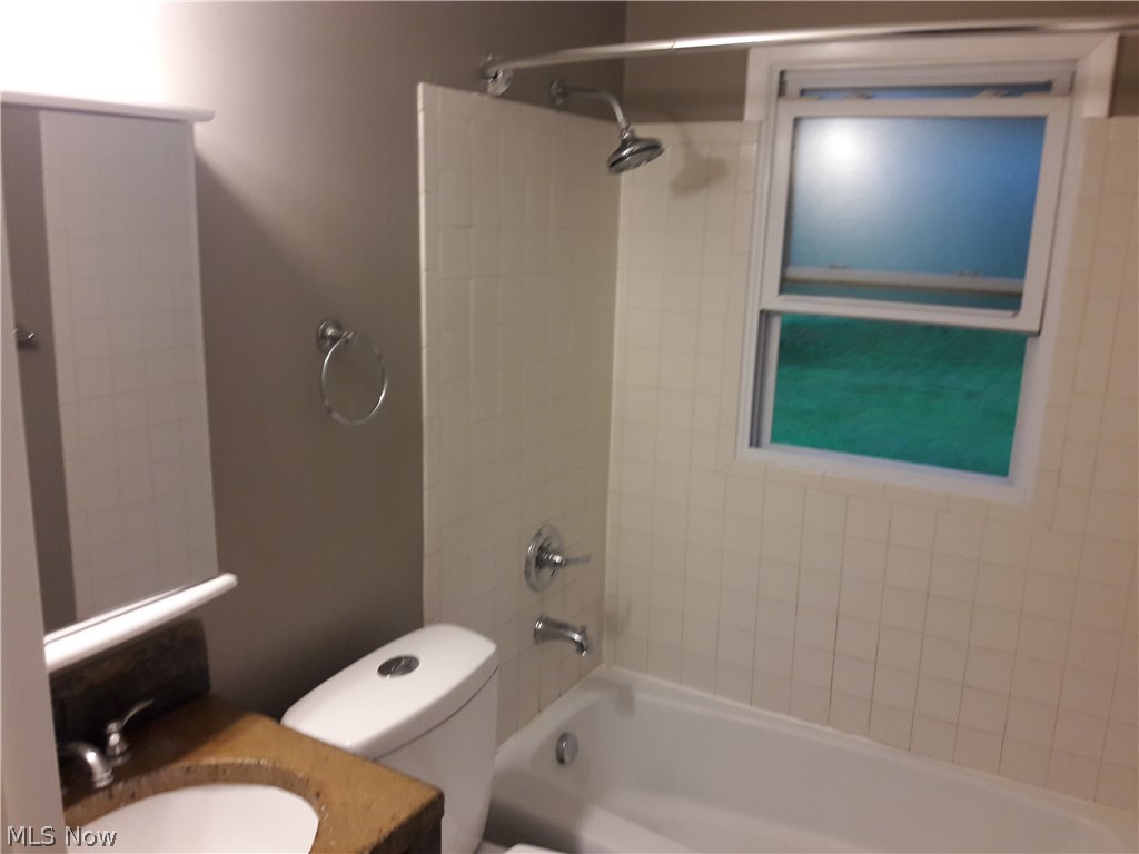4619 15th Street Northwest Canton, OH 44708 - Photo 22 of 26 Full bathroom with vanity, toilet, and tiled shower / bath combo