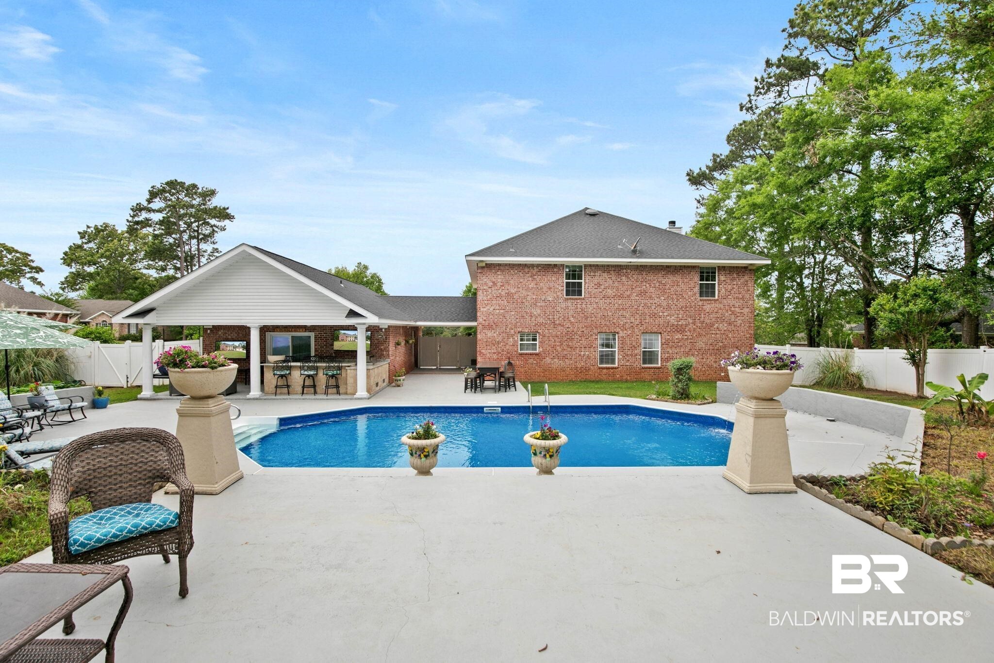 2 Speckle Trout Route Daphne, AL 36527 - Photo 48 of 61 View of pool featuring patio surround, a fenced backyard, an outdoor bar and dining area, and area for grilling