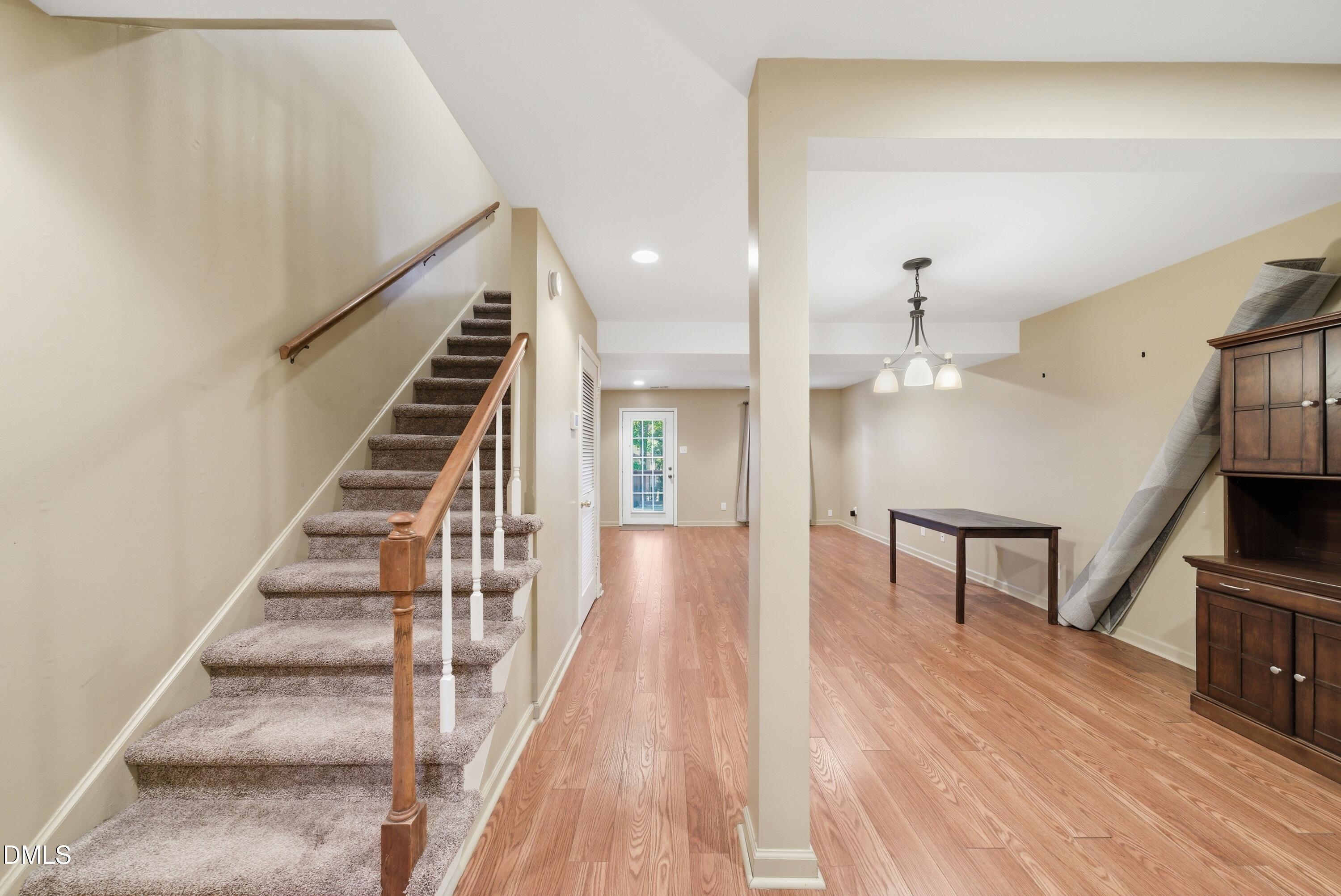 6355 New Market Way Raleigh, NC 27615 - Photo 8 of 30 a view of entryway and hall with wooden floor