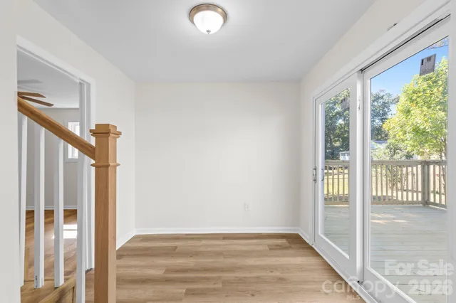 a view of an entryway with wooden floor and windows