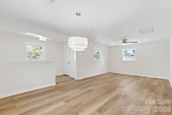 a view of an empty room and a window