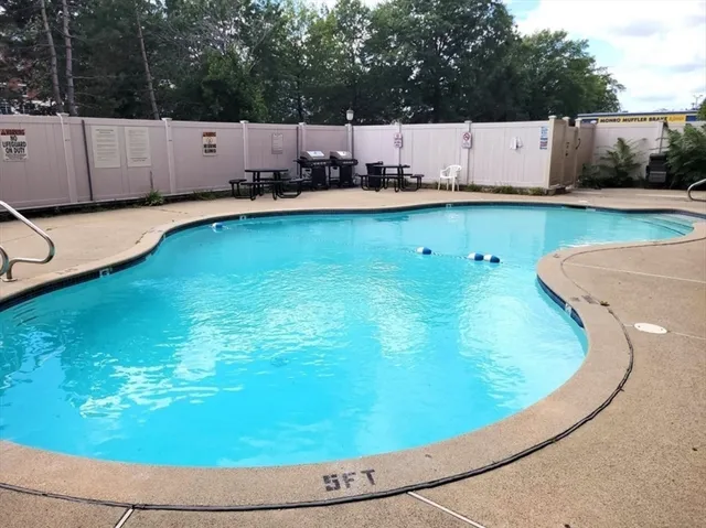 a view of a swimming pool with an outdoor space