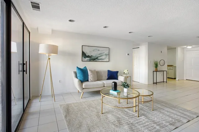 a living room with furniture and a rug
