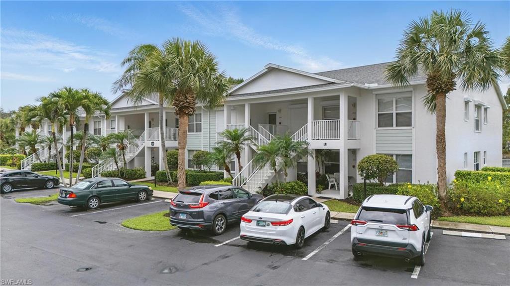 1220 Sarah Jean Circle, Unit L103 Naples, FL 34110 - Photo 37 of 50 a car parked in front of a house