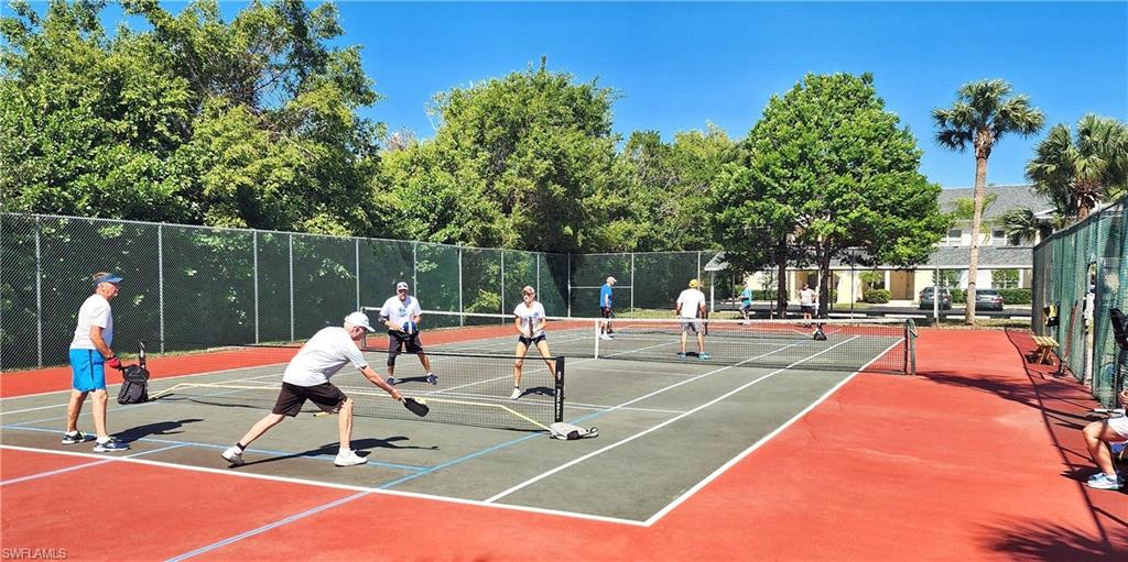 1220 Sarah Jean Circle, Unit L103 Naples, FL 34110 - Photo 39 of 50 a park view with a sitting space and lake view