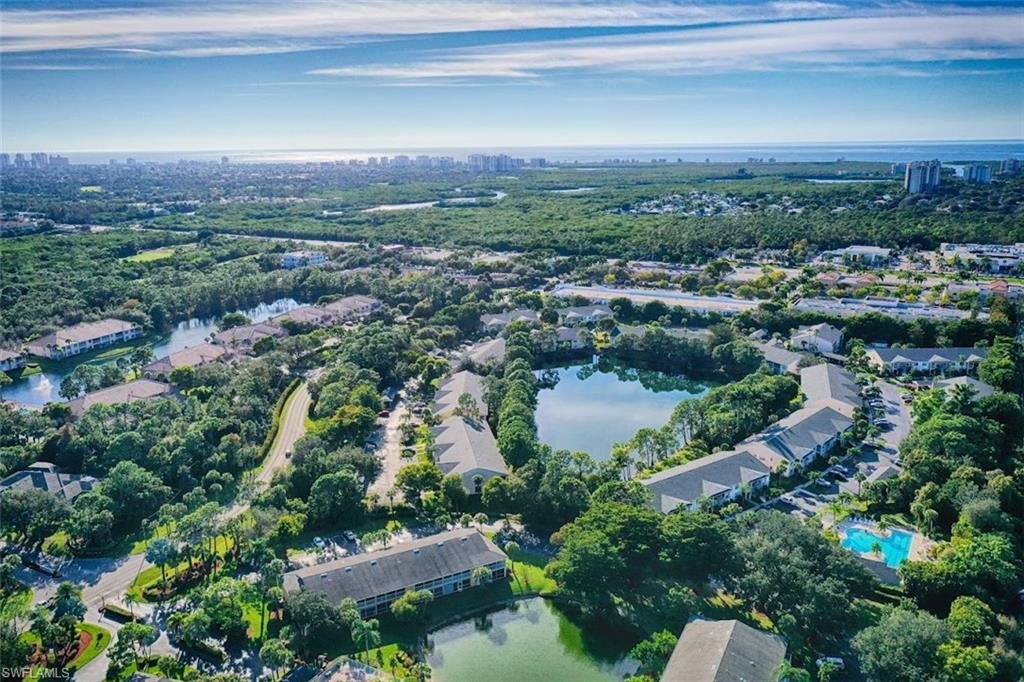 1220 Sarah Jean Circle, Unit L103 Naples, FL 34110 - Photo 50 of 50 Drone / aerial view with a water view
