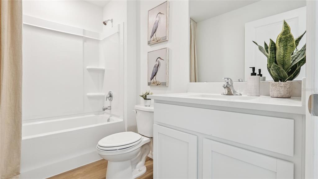 5279 Southwest 52nd Court Gainesville, FL 32608 - Photo 19 of 21 a bathroom with a sink a toilet and a bathtub