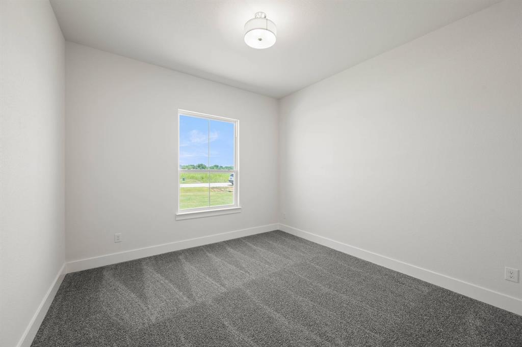 141 Olson Road Waxahachie, TX 75165 - Photo 13 of 24 an empty room with a window