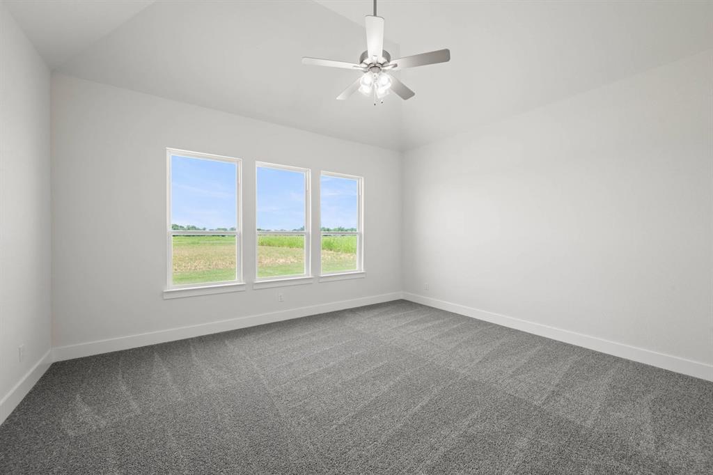 141 Olson Road Waxahachie, TX 75165 - Photo 17 of 24 an empty room with a window and a fan