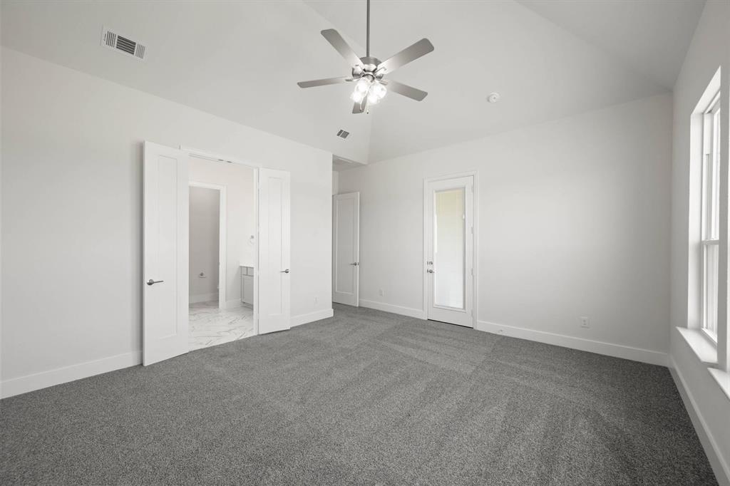 141 Olson Road Waxahachie, TX 75165 - Photo 18 of 24 an empty room with a ceiling fan and a window