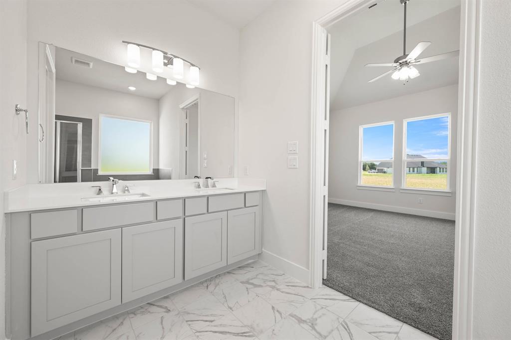 141 Olson Road Waxahachie, TX 75165 - Photo 21 of 24 a bathroom with a double vanity sink and a mirror