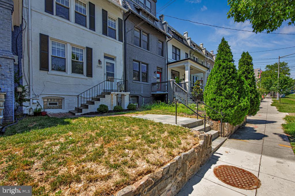 2406 37th Street Northwest Washington, DC 20007 - Photo 4 of 44 a view of a house with a yard
