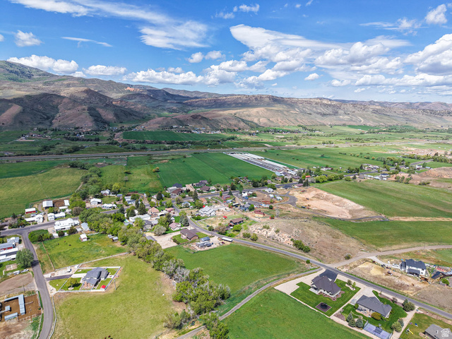 94 Spring Canyon Road Coalville, UT 84017 - Photo 25 of 50 Expansive aerial perspective showcasing a rural community nestled within a valley