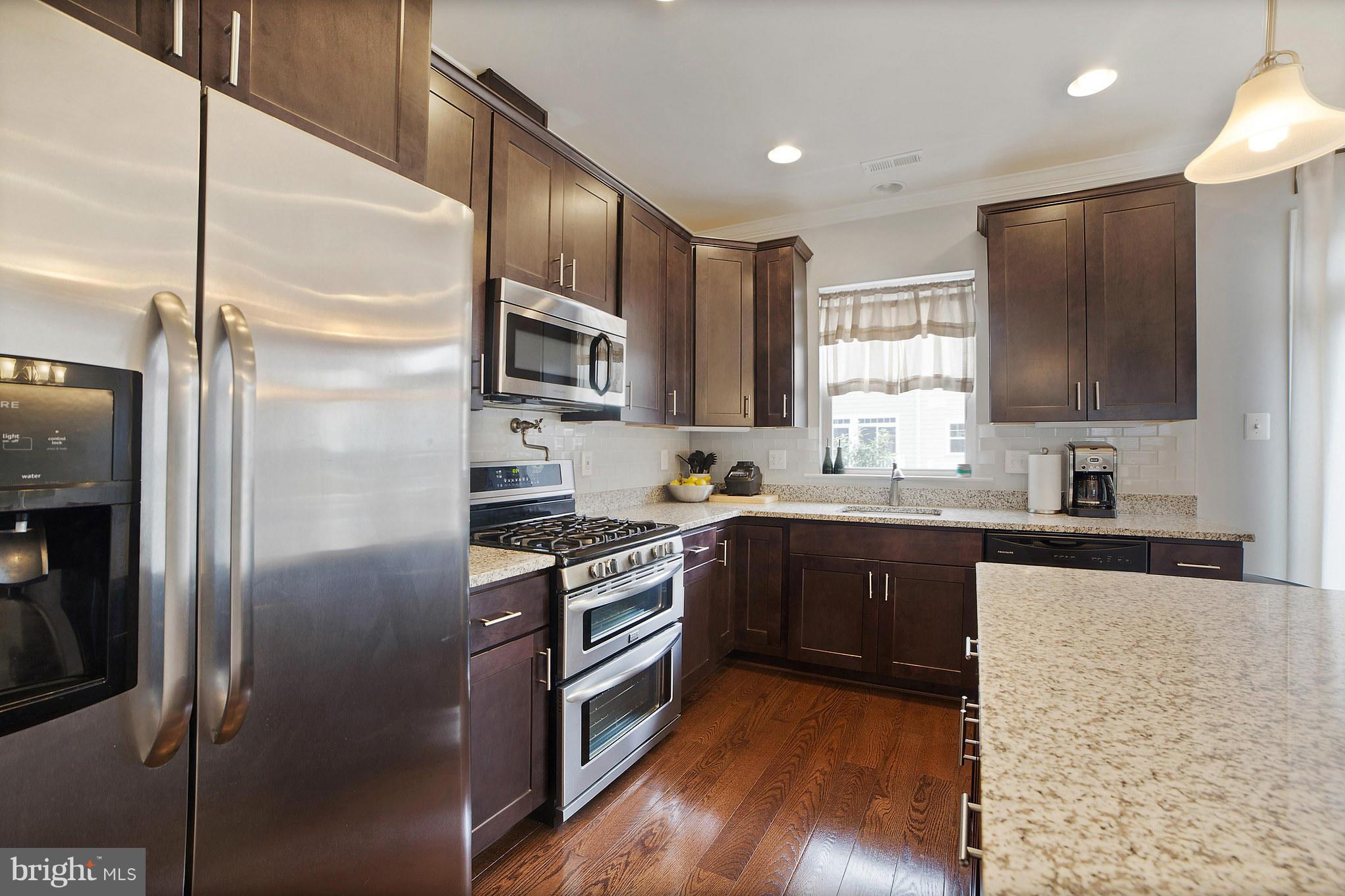 2041 Case Road Baltimore, MD 21222 - Photo 14 of 30 a kitchen with stainless steel appliances granite countertop a refrigerator a stove and a sink