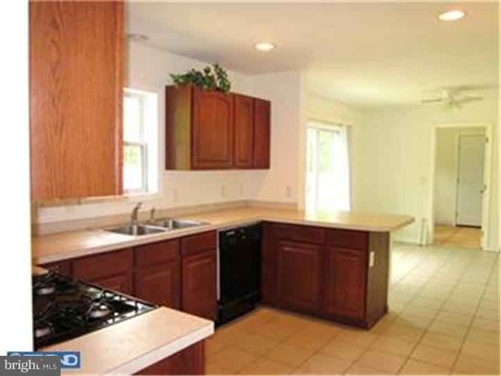 114 Sooy Place Road Tabernacle, NJ 08088 - Photo 11 of 24 a kitchen with a sink and a stove