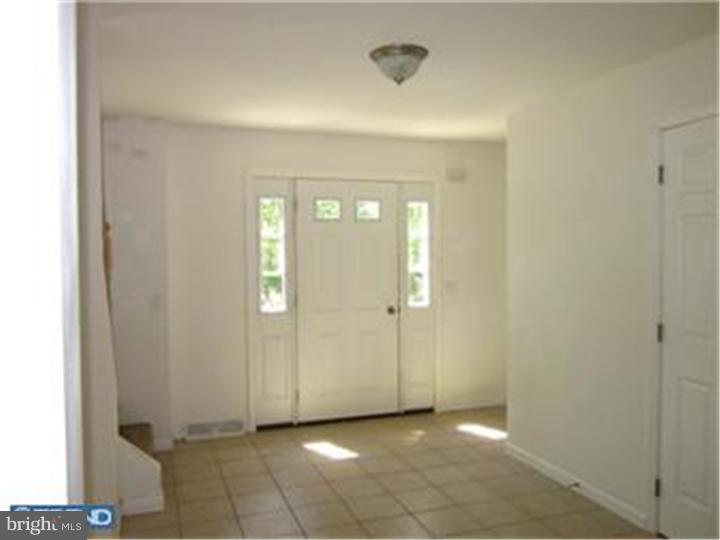 114 Sooy Place Road Tabernacle, NJ 08088 - Photo 3 of 24 a view of a hallway with wooden cabinets