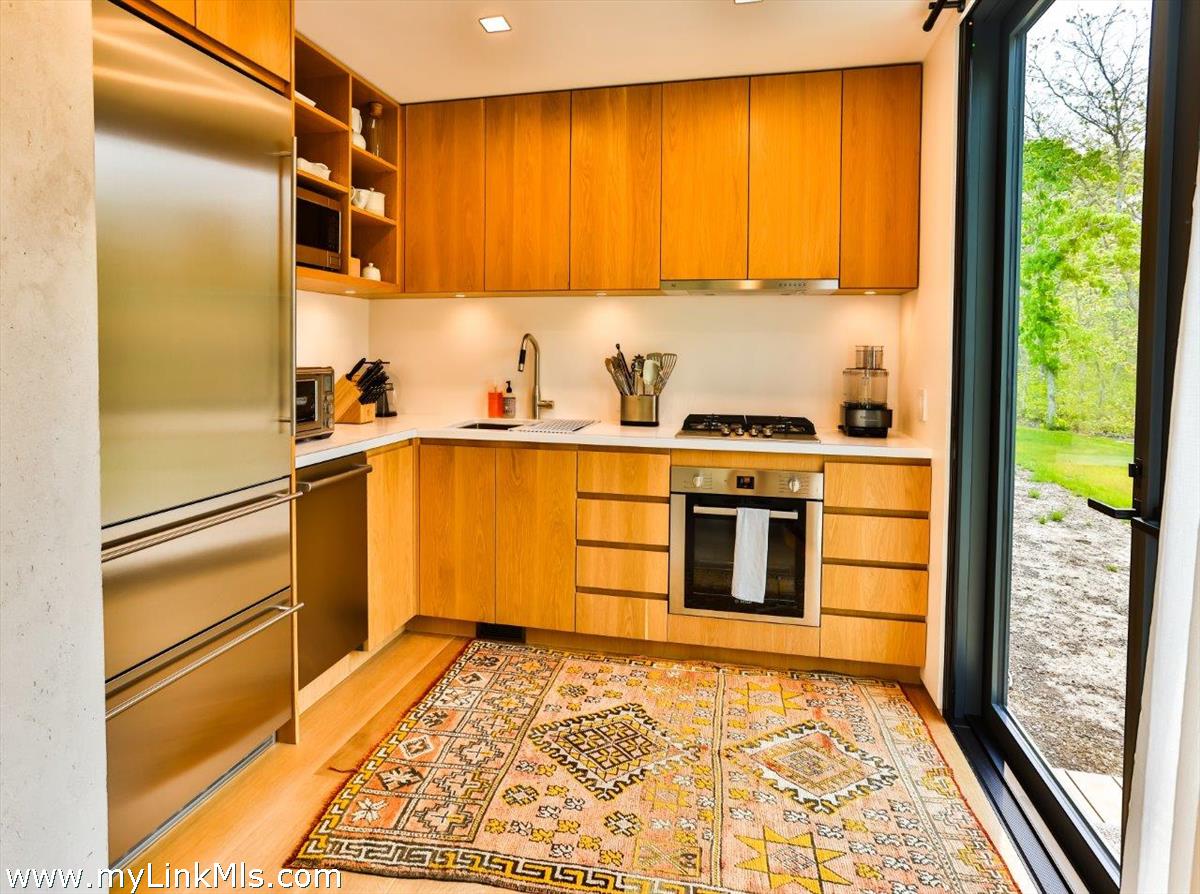 4 Jacob's Neck Road Edgartown, MA 02539 - Photo 7 of 20 a kitchen with a refrigerator and window