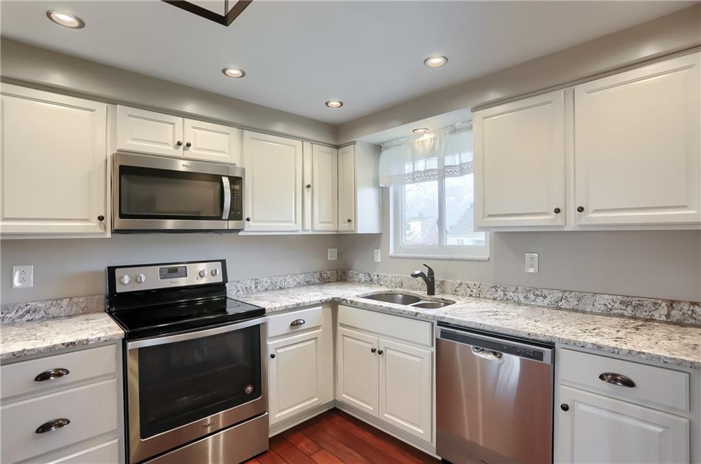 2202 Altaview Avenue Pittsburgh, PA 15226 - Photo 11 of 25 a kitchen with a sink stove and microwave