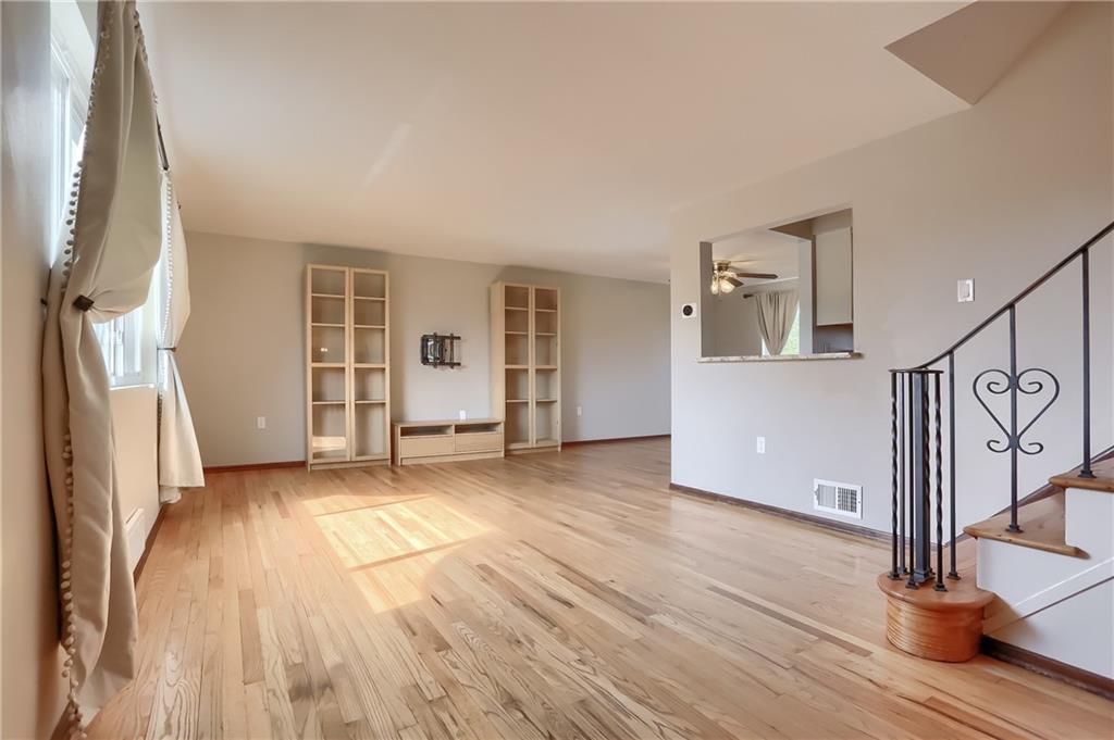 2202 Altaview Avenue Pittsburgh, PA 15226 - Photo 6 of 25 a view of a livingroom with wooden floor and stairs
