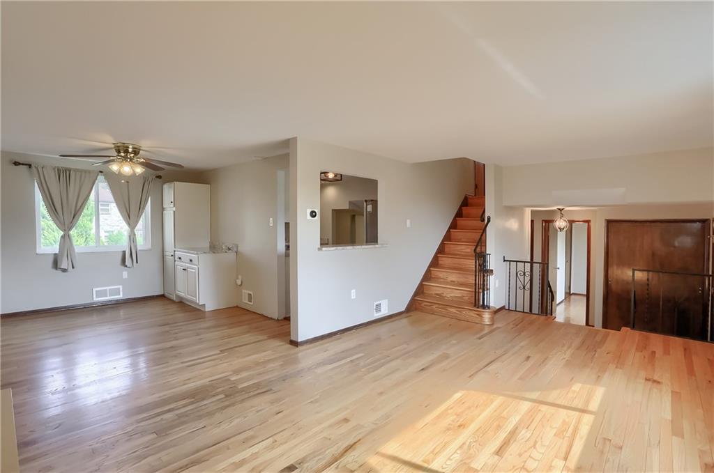 2202 Altaview Avenue Pittsburgh, PA 15226 - Photo 7 of 25 a view of a hallway with wooden floor and stairs