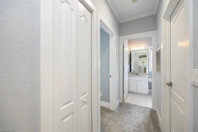 a view of a bathroom from a hallway