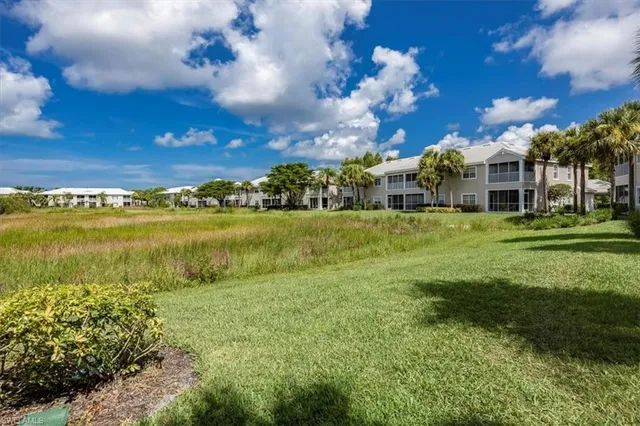 a view of a lake with a building in the background