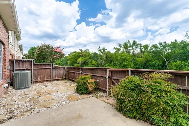 a backyard of a house with lots of green space